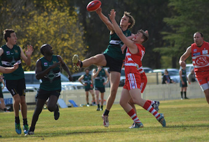 Tom Hunt winning a tap against the Swans.